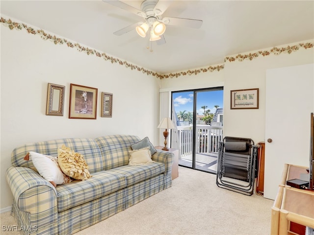 living room with ceiling fan and light colored carpet