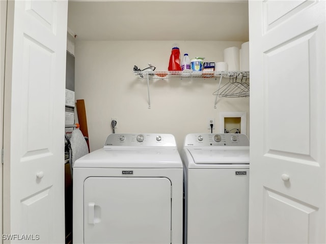 laundry room with separate washer and dryer