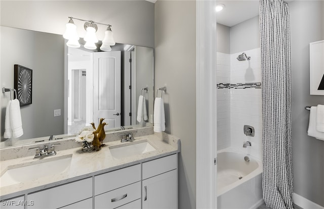 bathroom featuring washtub / shower combination, vanity, and a notable chandelier