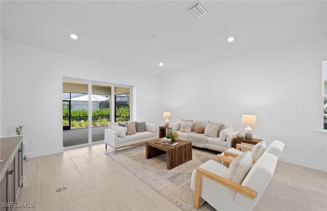 42202 Lake Timber Dr, Punta Gorda, FL 33982 - living room with baseboards and recessed lighting