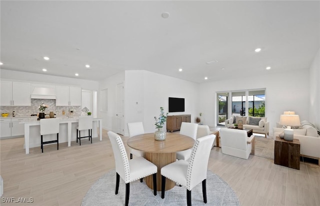 42202 Lake Timber Dr, Punta Gorda, FL 33982 - dining space with recessed lighting and light wood-style flooring