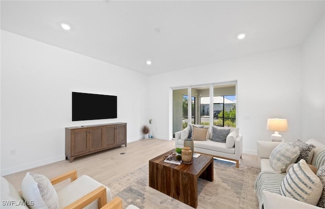 42202 Lake Timber Dr, Punta Gorda, FL 33982 - living room with light wood-style floors and recessed lighting