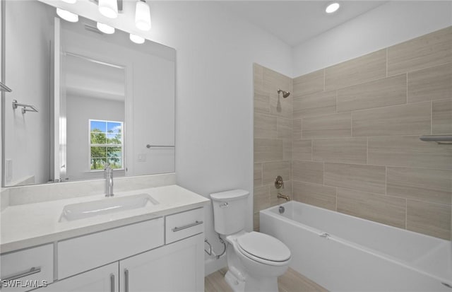 42202 Lake Timber Dr, Punta Gorda, FL 33982 - bathroom with vanity, bathtub / shower combination, and recessed lighting