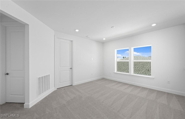 42202 Lake Timber Dr, Punta Gorda, FL 33982 - carpeted empty room featuring baseboards and recessed lighting