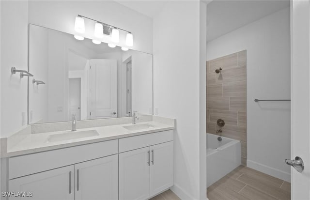 42202 Lake Timber Dr, Punta Gorda, FL 33982 - full bathroom with double vanity, bathtub / shower combination, and wood finished floors