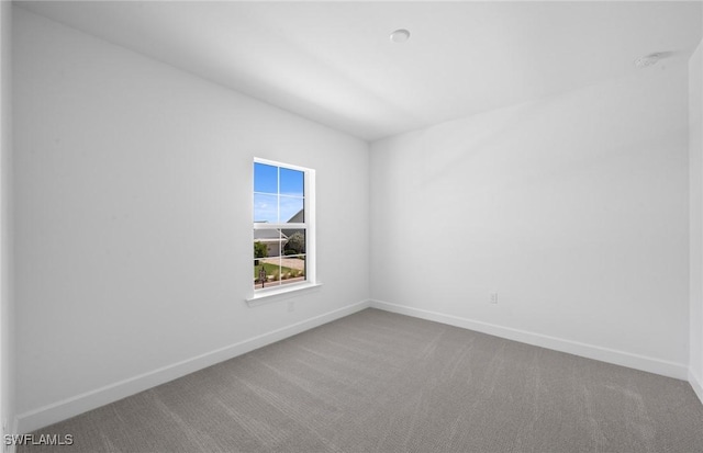 42202 Lake Timber Dr, Punta Gorda, FL 33982 - carpeted spare room featuring baseboards