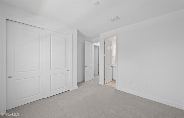 42202 Lake Timber Dr, Punta Gorda, FL 33982 - unfurnished bedroom featuring carpet floors, a closet, and ensuite bath