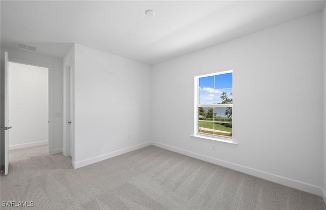 42202 Lake Timber Dr, Punta Gorda, FL 33982 - unfurnished room featuring light colored carpet and baseboards
