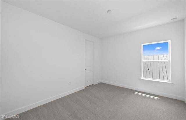 42202 Lake Timber Dr, Punta Gorda, FL 33982 - carpeted empty room with baseboards