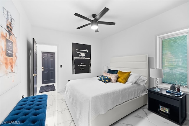 bedroom with multiple windows and ceiling fan