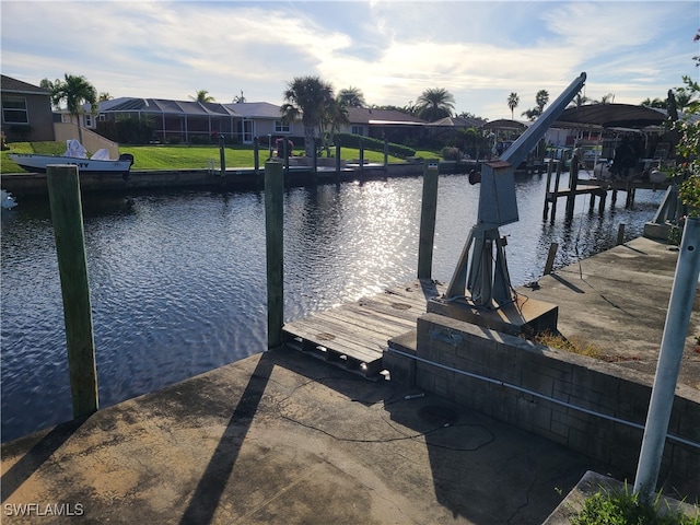 view of dock featuring a lanai and a water view