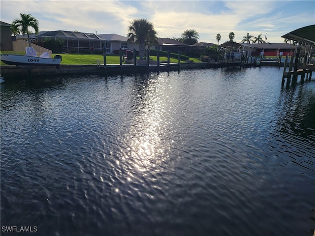 property view of water with a dock