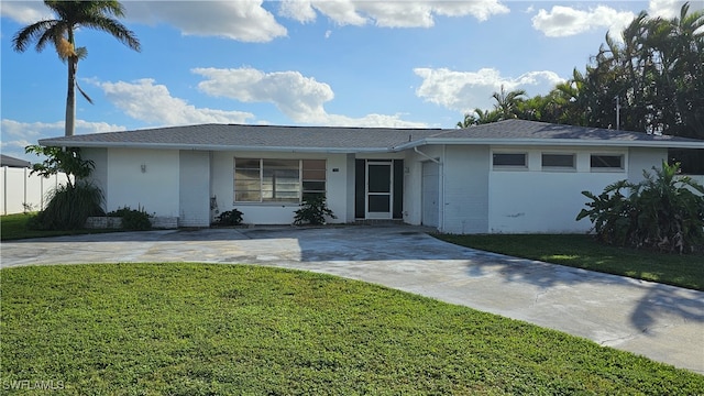 ranch-style house with a front lawn