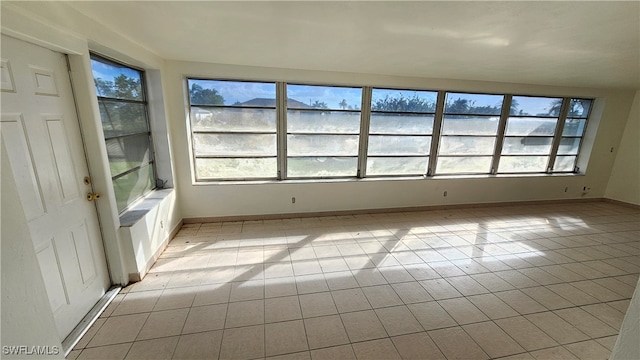 empty room featuring light tile patterned floors