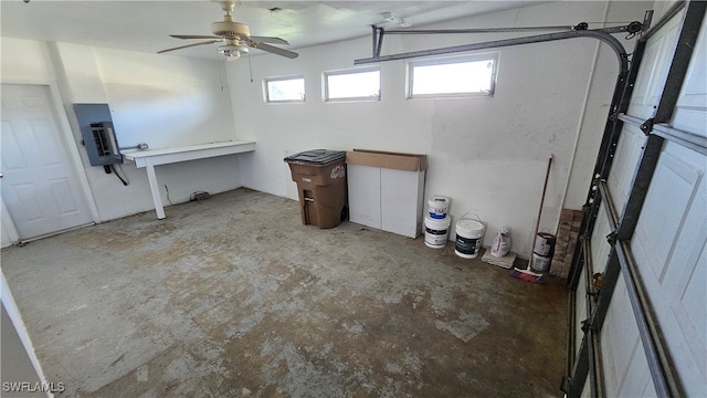 garage with electric panel and ceiling fan