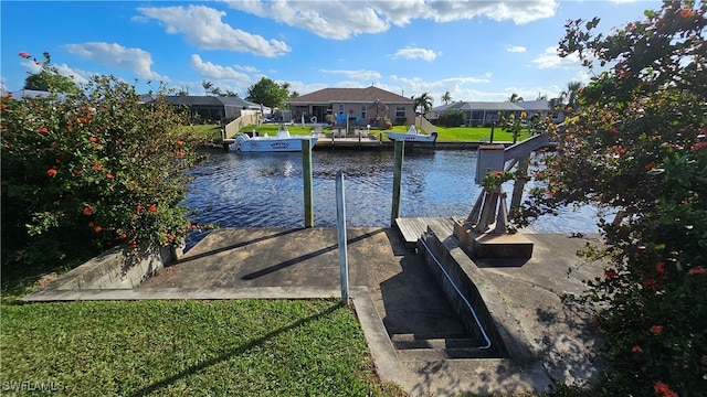 view of dock with a lawn, glass enclosure, and a water view