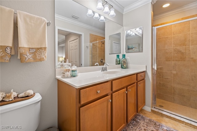 bathroom featuring tile patterned floors, crown molding, vanity, an enclosed shower, and toilet