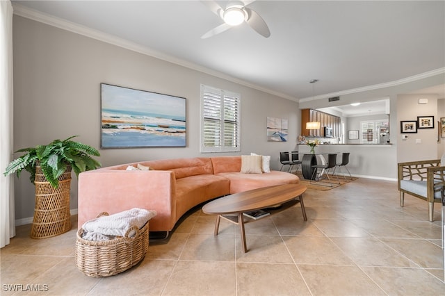 living room with light tile patterned flooring, ceiling fan, and crown molding