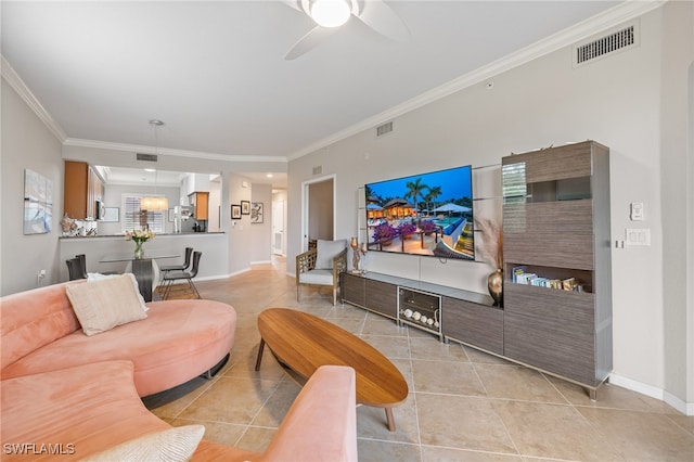 tiled living room with ceiling fan and ornamental molding