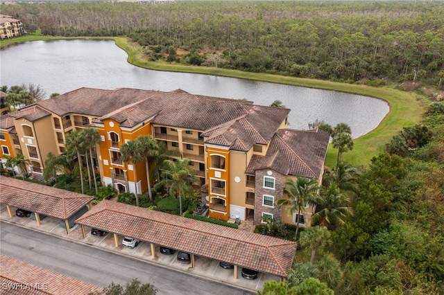 birds eye view of property with a water view