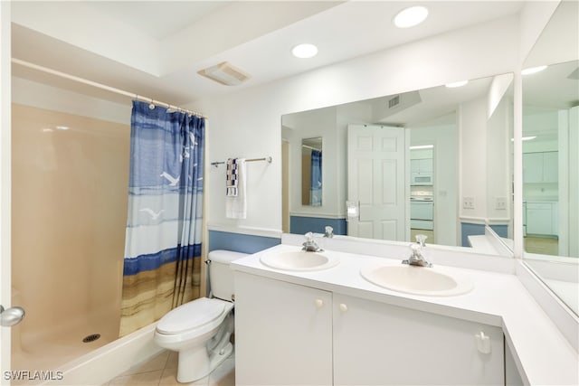 bathroom featuring curtained shower, tile patterned flooring, toilet, and washer / dryer