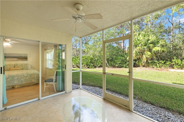 sunroom featuring ceiling fan