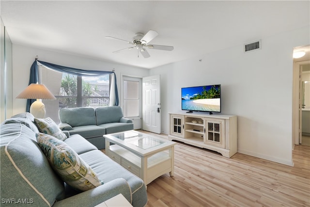 living room featuring light wood-type flooring and ceiling fan