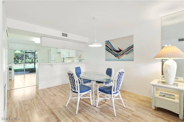 dining room with light hardwood / wood-style flooring