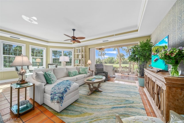 sunroom featuring ceiling fan