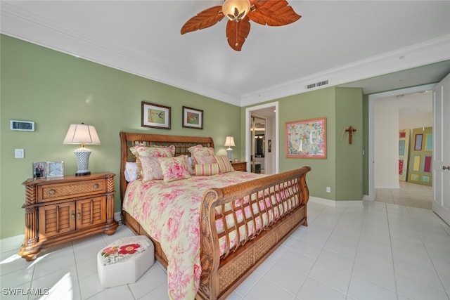 bedroom featuring ceiling fan, light tile patterned flooring, and crown molding