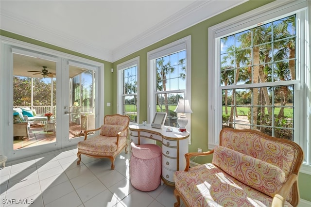 sunroom / solarium featuring ceiling fan