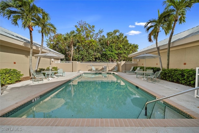 view of swimming pool featuring a patio area