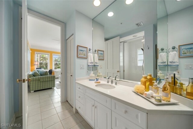 bathroom featuring tile patterned floors and vanity