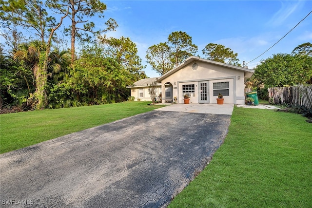 ranch-style home with a front lawn