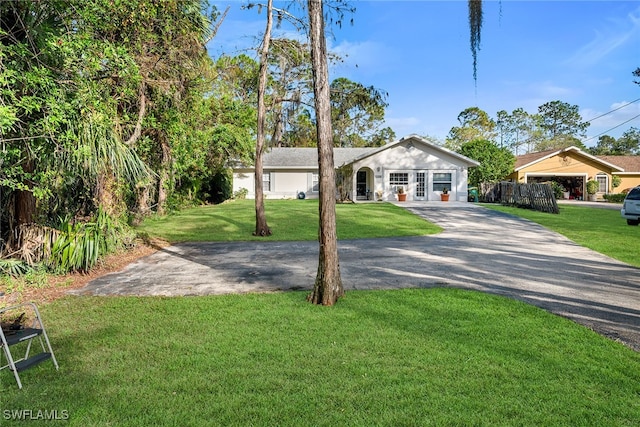 ranch-style house featuring a front lawn