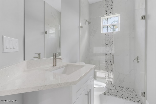 bathroom featuring vanity, toilet, tile patterned floors, and a shower with door