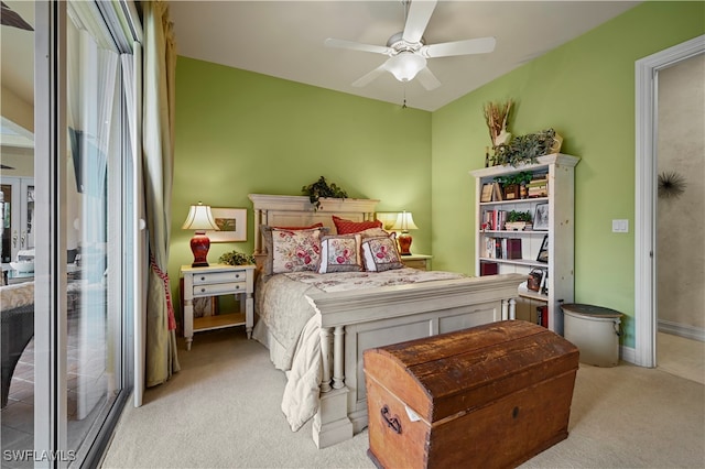 bedroom featuring ceiling fan and light colored carpet