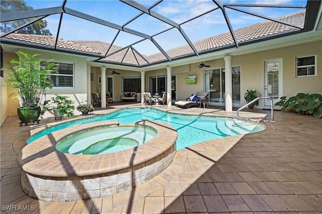 view of pool with ceiling fan, an in ground hot tub, and a patio