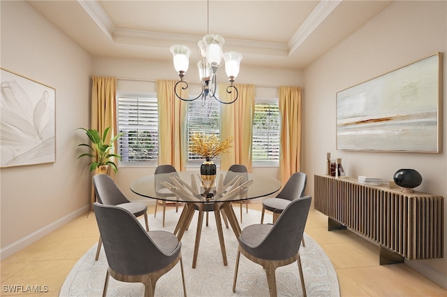 dining area featuring an inviting chandelier, light tile patterned floors, crown molding, and a tray ceiling