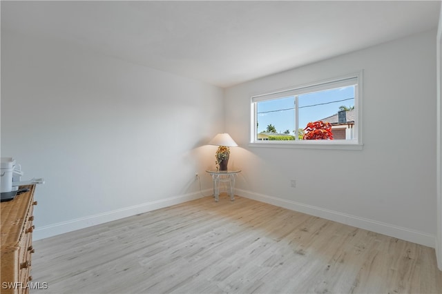 spare room with light wood-type flooring