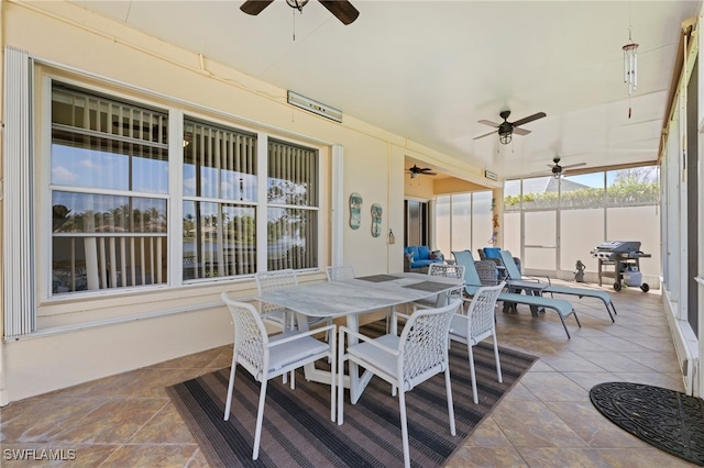 view of patio with area for grilling and ceiling fan