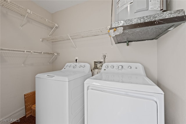 laundry area with separate washer and dryer