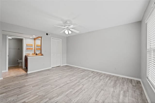 unfurnished bedroom featuring light hardwood / wood-style flooring and multiple windows