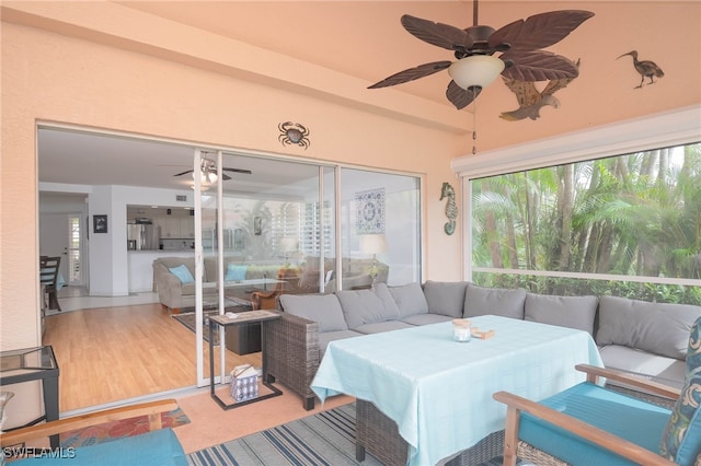 sunroom / solarium with ceiling fan