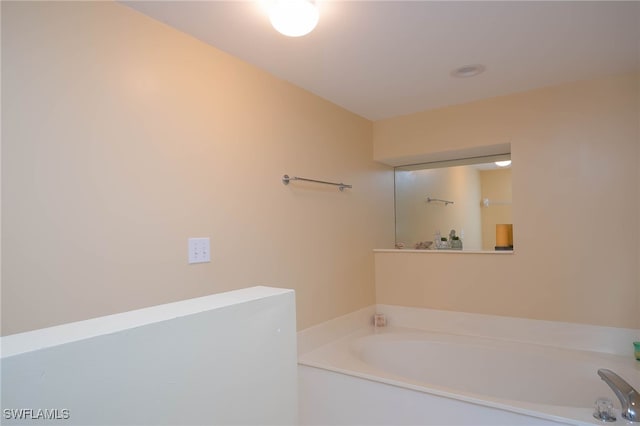 bathroom featuring a washtub