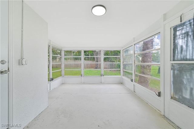 unfurnished sunroom featuring a wealth of natural light