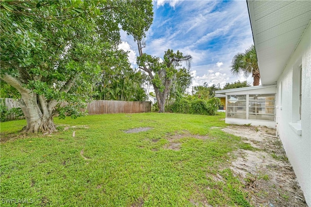 view of yard featuring a sunroom