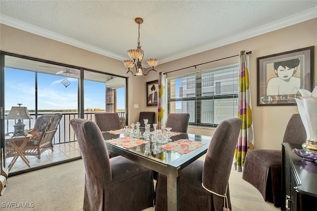 dining area with light colored carpet, a textured ceiling, a wealth of natural light, and a notable chandelier