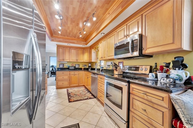 kitchen featuring appliances with stainless steel finishes, wood ceiling, light tile patterned floors, dark stone countertops, and ornamental molding