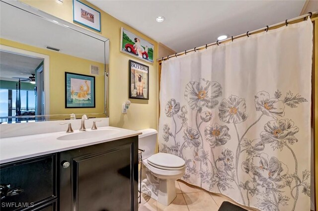 bathroom featuring vanity, toilet, and tile patterned floors